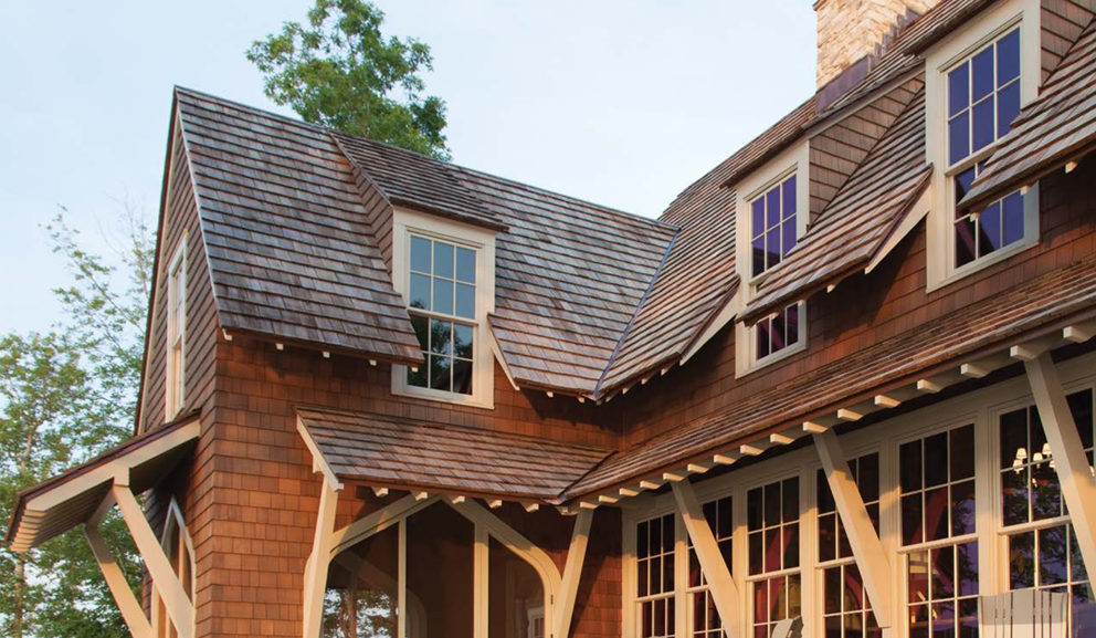 House with 3 windows and wood roof.